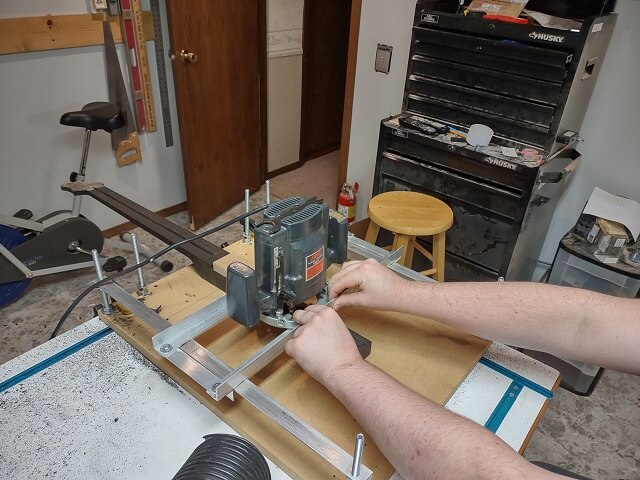 Using the router sled to cut the second neck recess.