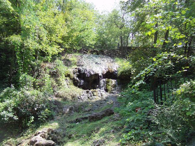 A waterfall being fed by the natural spring.
