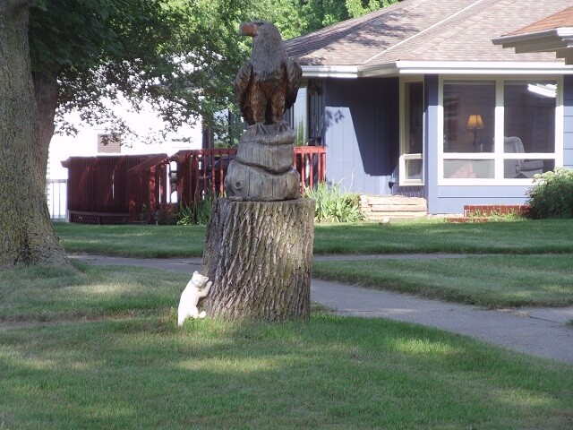 Carved eagle on a tree stump.