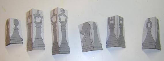 The paper patterns for the chess pieces.