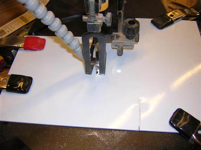 My makeshift zero-clearance top for the scroll saw.