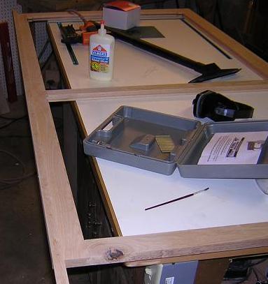 Attaching the edge piece that will cover the drawer slides.